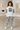 Female-model hoodie editorial in a contemporary gallery