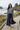 Female model in grey Oregon tee with navy maxi skirt