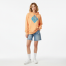 Female model in peach Surfxion hoodie with shorts