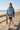 Female model in Ridgeline hoodie on beach boardwalk