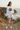 Female model in white Oregon tee with ivory shorts