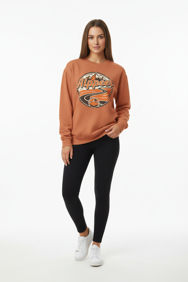 Female model in yam orange sweatshirt with black leggings