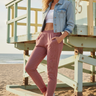 Female model styling the joggers with a cropped denim jacket