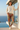 Female model styling the joggers with an oversized cream sweatshirt