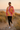 Female model styling the sunburst sweatshirt with black leggings