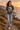 Female model wearing the army tee on a coastal cliff path
