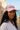 Female model wearing the Blossom pink WaveCrasher cap