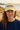 Female model wearing the Butter yellow WaveCrasher cap
