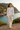 Female model wearing the floral sweatshirt with ivory linen pants