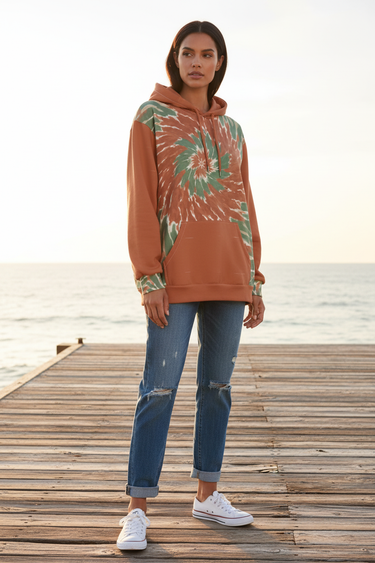 Female model wearing the hoodie with distressed blue jeans
