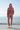 Female model wearing the matching rose set at a coastal villa
