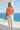 Female model wearing the sunburst sweatshirt with cream joggers