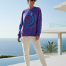 Female model wearing the tie-dye sweatshirt with cream joggers