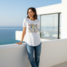 Female model wearing white graphic tee and distressed blue jeans