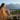Female model wrapped in blanket on porch