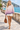 Female promenade look with ivory shorts