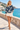 Female promenade look with ivory shorts
