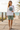 Female reference model wearing the white Oregon long-sleeved tee with shorts
