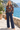 Floral bomber jacket styled with tailored navy pants