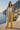 Floral bomber styled with yellow tailored pants