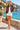 Floral bomber with tailored shorts on the seaside promenade