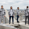 Four jacket looks in an urban rooftop editorial banner