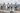 Four jacket looks in an urban rooftop editorial banner