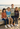 Four kids on a coastal boardwalk, mobile banner