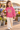 Four-year-old in raspberry hoodie at a flower market