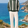 Front-facing coastal look with the same model in the forest-green and cream sweater