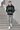 Geometric hoodie styled on concrete stairs