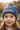 Girl age 4 wearing blue beanie