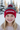 Girl age 5 wearing red pom-pom beanie