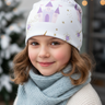 Girl age 8 wearing castle beanie