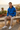 Golden-hour terrace editorial with stone joggers