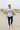 Grey graphic tee and joggers among coastal dunes
