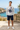 Heather grey sweatshirt with navy shorts