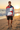 Hoodie editorial with black boardshorts on beach