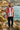 Hoodie styled with dark denim on a rocky coastline