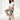 Woman sitting in camo-print pajama pants