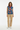 Geometric tribal vest with beige corduroy pants for relaxed casual style