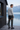 Joggers back view at a lakeside cabin