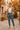 Joggers with ivory silk blouse and cropped camel jacket