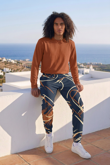 Joggers with rust tee on rooftop