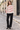 Knitted sweater styled with black tailored trousers