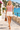 Knitted vest with ivory shorts on the promenade