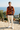Leaf-print sweater on a Mediterranean terrace