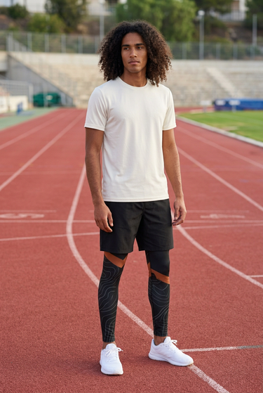 Leggings with black sports shorts on an athletics track