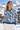 Look 1: female model, ski resort base