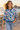 Look 5: female, jeans, coastal boardwalk at golden hour